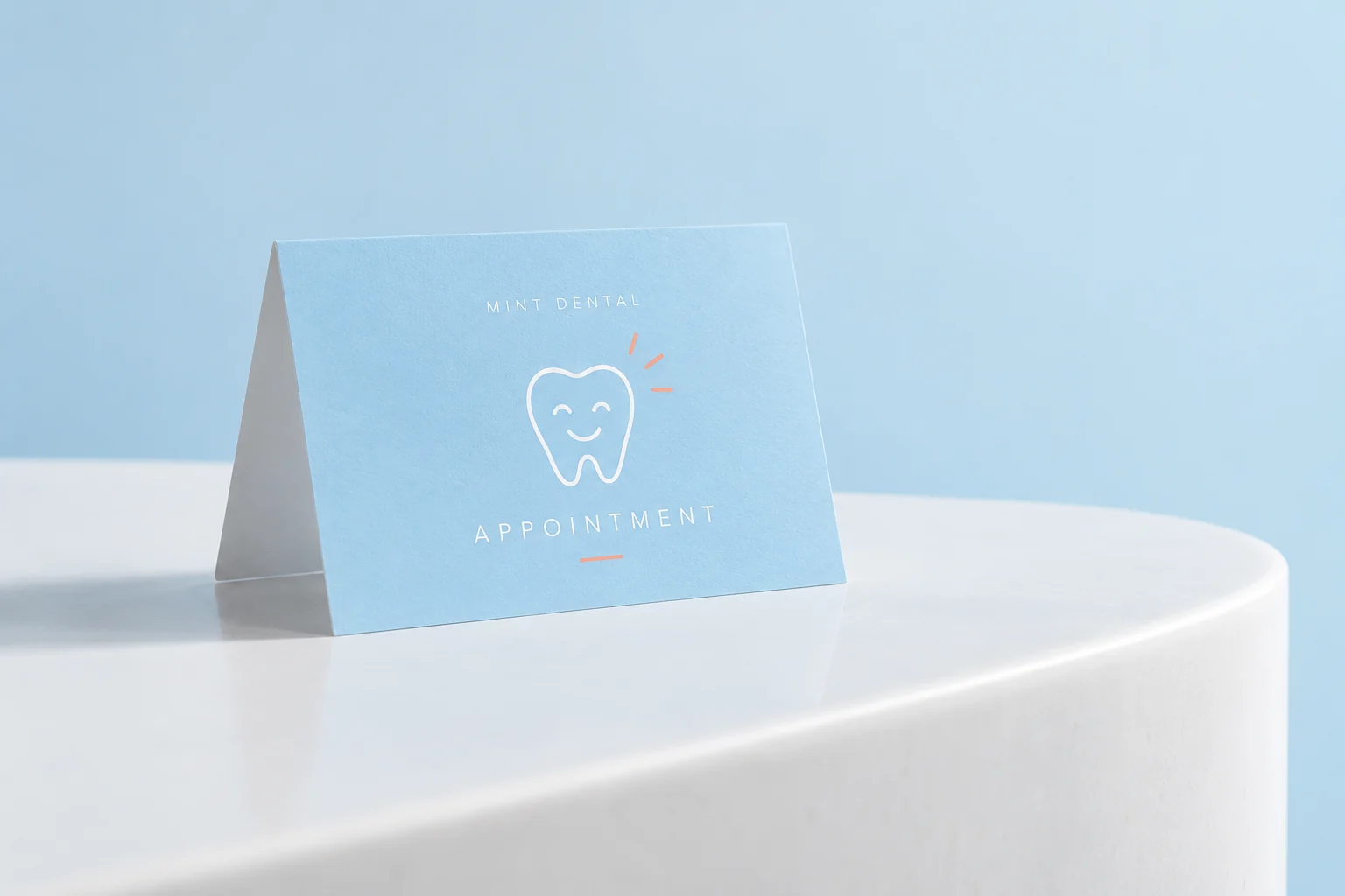 Illustrative mockup: a sky-blue dental appointment card on a clean white reception ledge