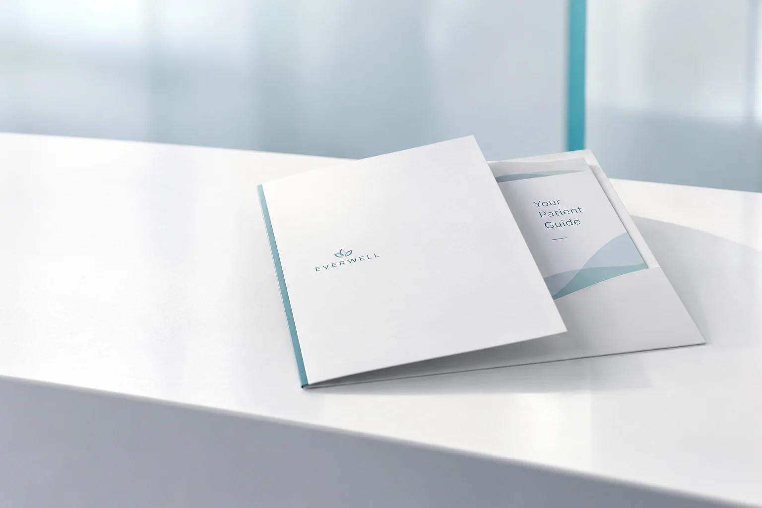 Illustrative mockup: a white welcome folder and patient guide on a clean clinic reception counter